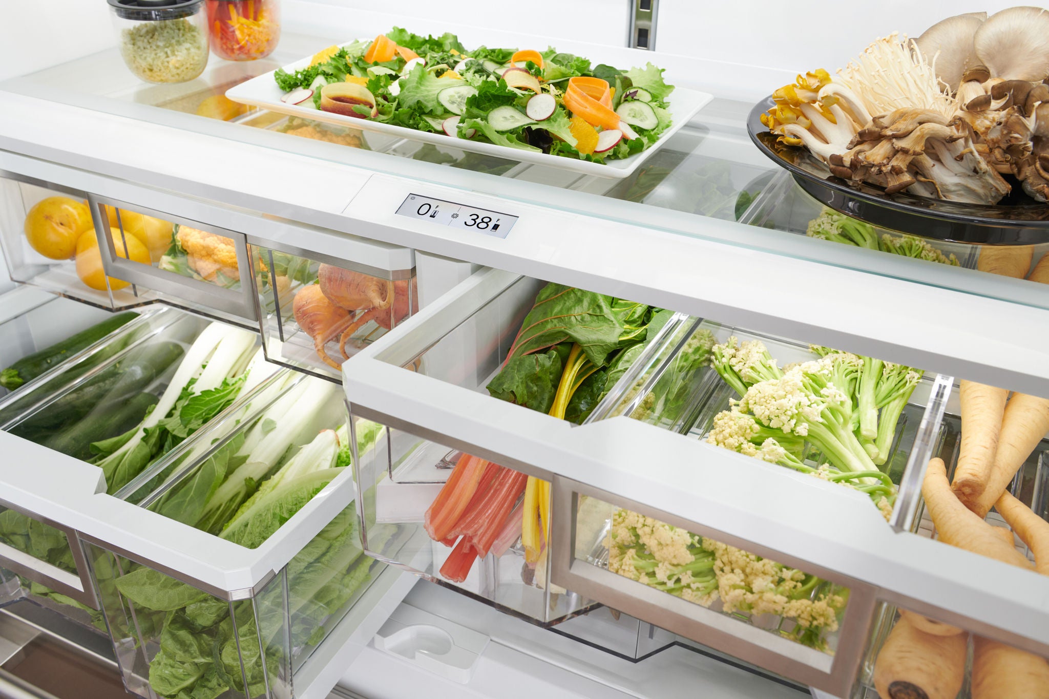 Fresh produce organized inside a Sub-Zero refrigerator